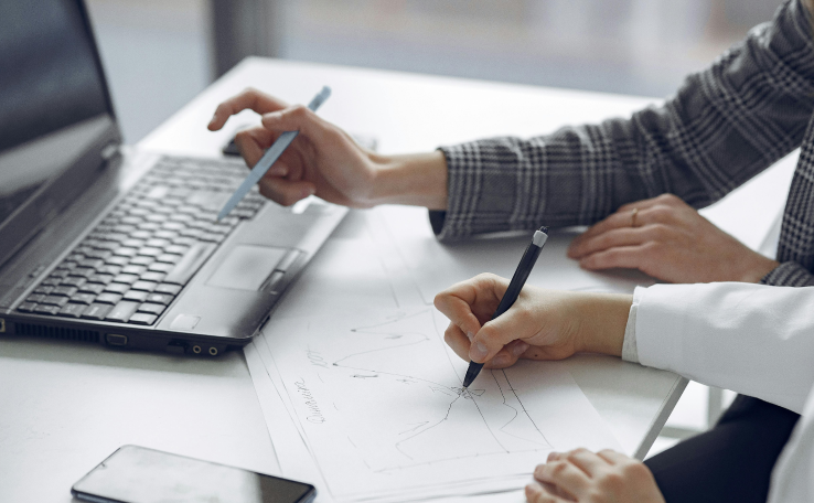 Expert pointing at financial charts